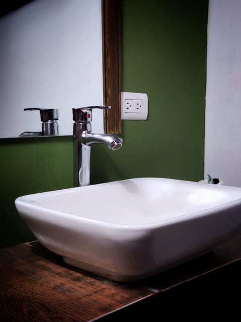 Basic Quadruple Room | Bathroom | Shower, rainfall showerhead, towels, soap