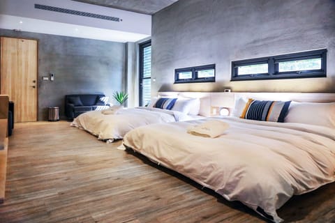 Standard Quadruple Room (Mahumhum) | Free minibar, individually decorated, desk, laptop workspace