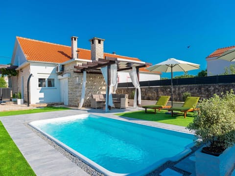 Typical dalmatian county house with a swimming pool