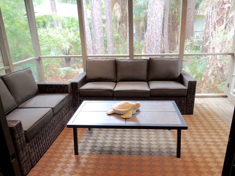 Screened porch with new couch and love seat - comfy place to enjoy your coffee