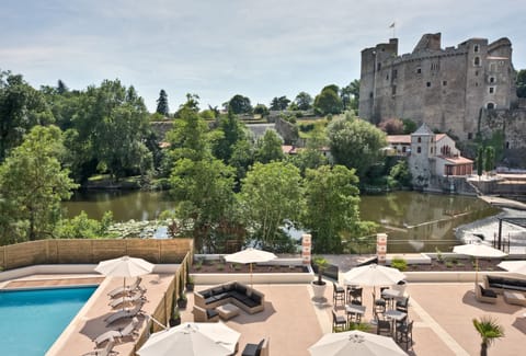 Seasonal outdoor pool, open 9:00 AM to 10:00 PM, sun loungers