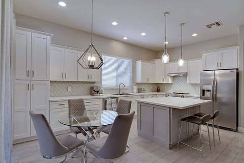 View of the dining area and kitchen off the living room and patio.