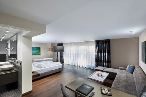 Superior Suite, Multiple Beds, Balcony | Free minibar, in-room safe, desk, laptop workspace