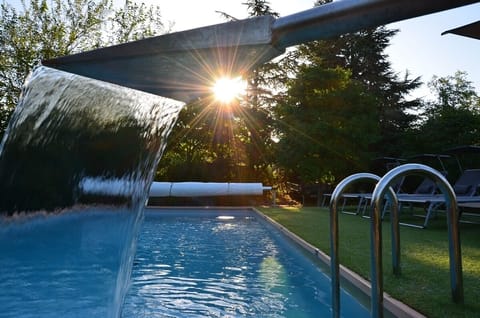 Seasonal outdoor pool, open 11:00 AM to 8:00 PM, sun loungers