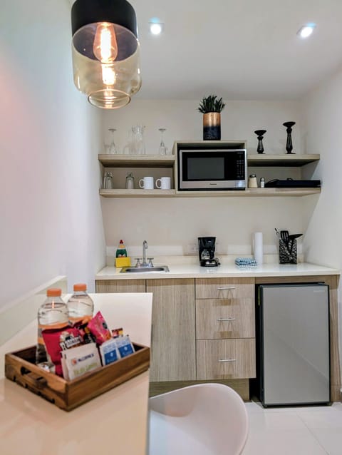 Studio with kitchenette, King bed, 1 bath | Private kitchen | Full-size fridge, microwave, coffee/tea maker, rice cooker