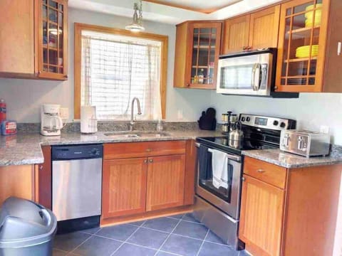 Kitchen includes dishwasher, microwave, toaster & coffee maker