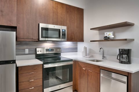 Suite, 1 Bedroom | Desk, laptop workspace, blackout drapes, iron/ironing board