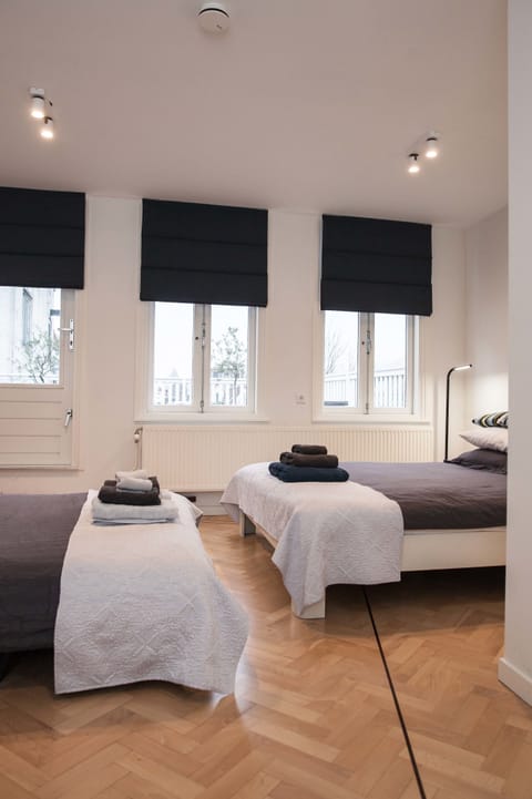 Deluxe Quadruple Room, 1 Queen Bed with Sofa bed, Balcony, City View | Pillowtop beds, individually decorated, desk, free WiFi