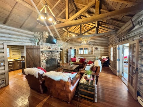 Grand living room for all to enjoy by the fireplace!