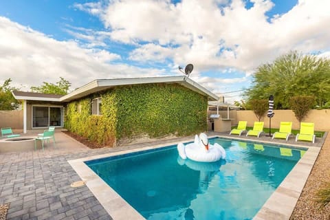 Your private backyard oasis with a heated pool, fire pit, and BBQ grill—ideal for sun or sunset relaxation.