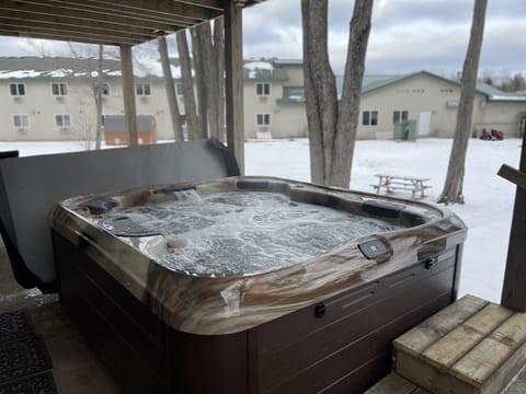 Hot tub with covered deck above