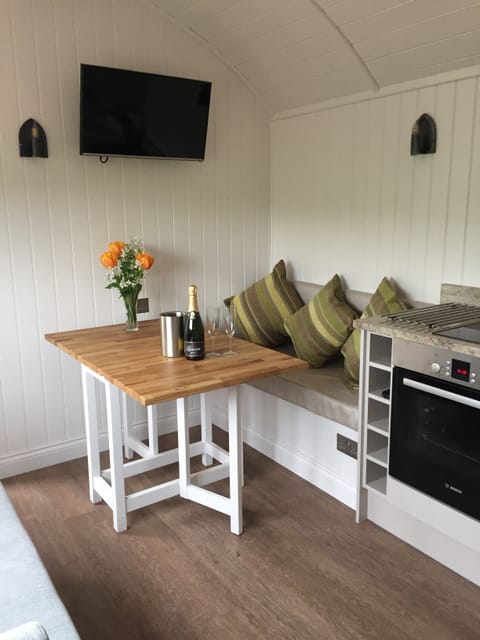 The settee can be moved into position for dining.