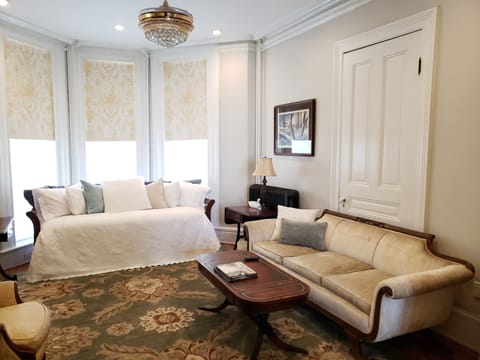 Living room has a trundle bed, automatic black-out blinds and a 55" smart TV.