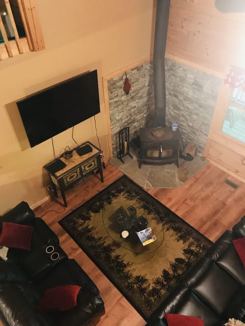 Reclining leather sofas and a 65” smart TV