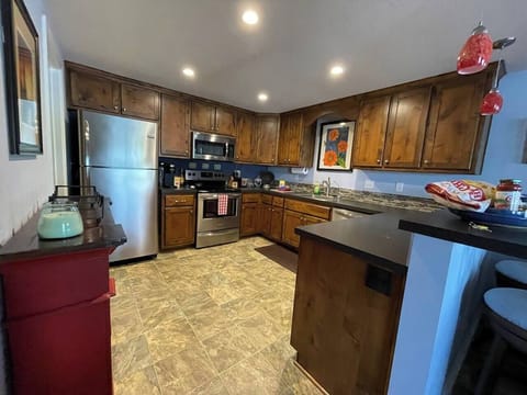 Large kitchen with Whirlpool Profile appliances. Refrig has an ice maker!
