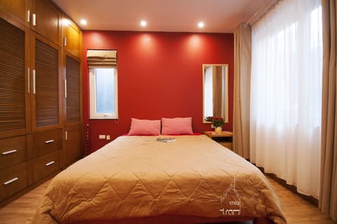bedroom with 2 big and 01 small windows