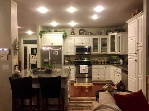 Fully stocked kitchen with full view of lake.