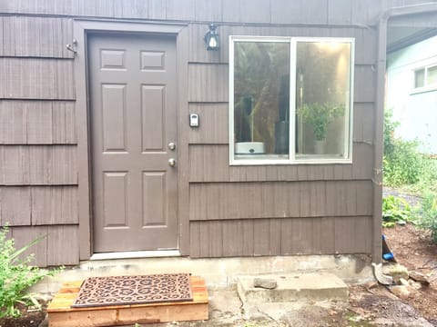 This is the entrance to the studio apartment. It is in the back of the house.