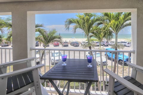 Private Beach-facing Balcony with Outdoor Seating for Sunset Viewing