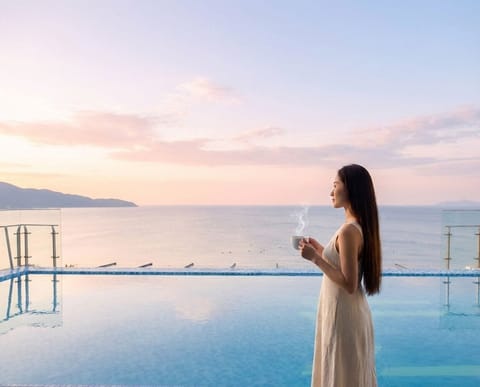 Outdoor pool, open 6:00 AM to 10:00 PM, pool umbrellas, sun loungers