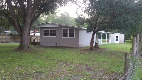 Front of La Fish Camp Cottage. River view behind.