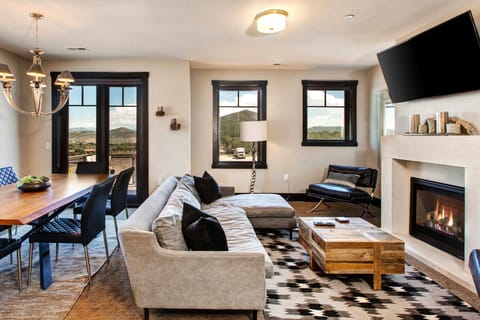 Cozy Living Room with a Gas Fireplace and Expansive Views