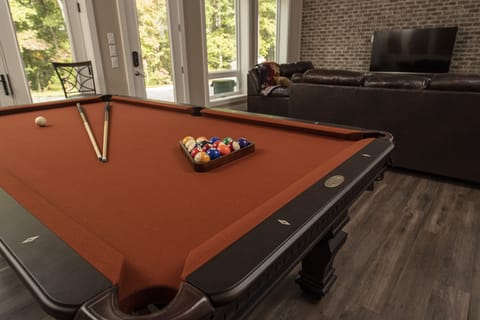 The Terrace Level features full sized pool table, kitchen and living area 