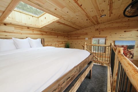 Stargazing in bed at treehouse cabin #9 at East Zion Resort conveniently located between Zion and Bryce Canyon national parks.
