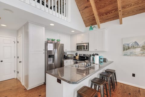 Fully stocked kitchen, open floor plan.