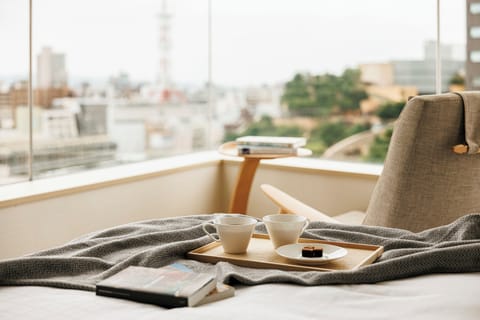 Premium bedding, down comforters, in-room safe, desk