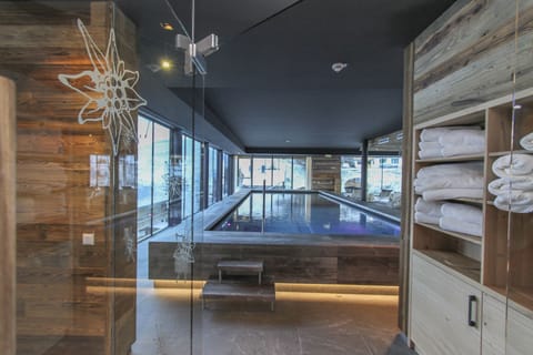 Indoor pool, outdoor pool, pool umbrellas, sun loungers