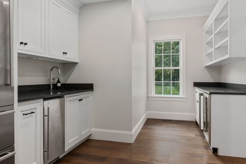 Butler Pantry with second fridge, wine fridge, microwave.