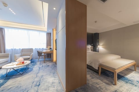 Suite, 1 King Bed (Additional Living Area) | Minibar (free items), in-room safe, desk, laptop workspace