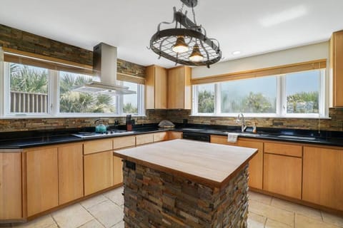 Kitchen island for prep work along with a stunning light fixture