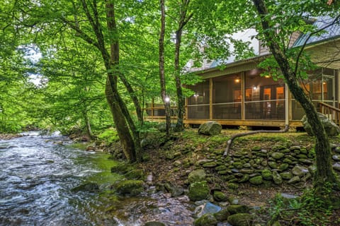 Nestled beside a tranquil creek, this charming retreat offers a peaceful escape surrounded by lush forest and the soothing sounds of flowing water.