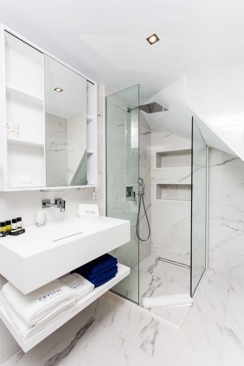 Shower, hydromassage showerhead, designer toiletries, hair dryer