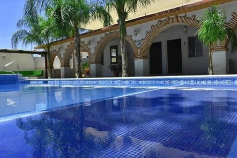 Outdoor pool, open 8:00 AM to 9:00 PM, pool umbrellas, sun loungers