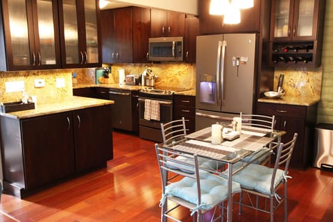 Open floor plan on main level with living room, dining area, and kitchen