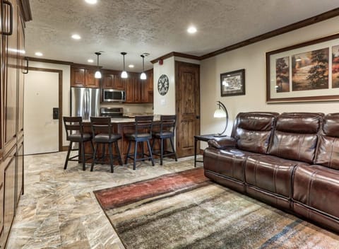 Living room and custom peninsula with room to seat 4 in the kitchen.