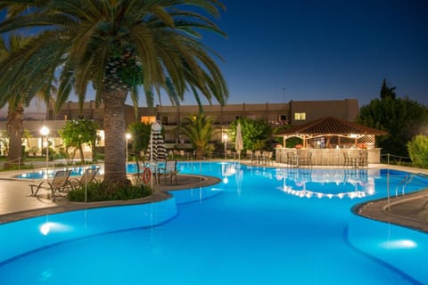 Seasonal outdoor pool, open 9:00 AM to 8:00 PM, pool umbrellas