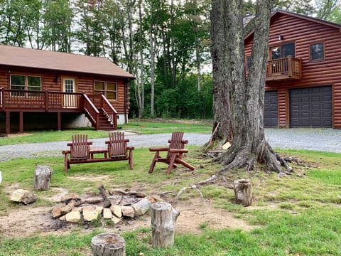 View of both cabins and fire pit