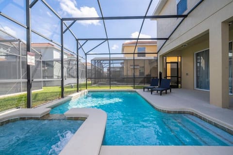 Private screened pool and spa at dusk