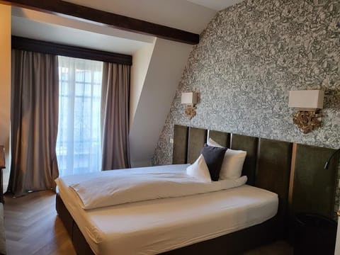 Double or Twin Room | Minibar, desk, blackout drapes, iron/ironing board