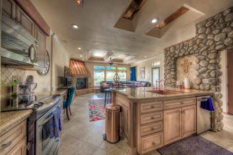 The beautiful kitchen opens up to the living room for an open style entertainment area.