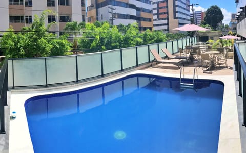 Outdoor pool, pool umbrellas, sun loungers