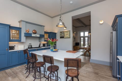 The Kitchen Island ,  the dining room and double doors to the garden
