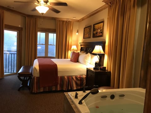 Bedroom with King Bed and a jacuzzi tub. Also beautiful views from balcony.