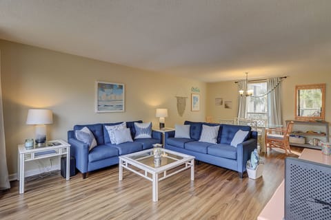 Living Room - location across the street from the beach - The living room and dining area has upscale furnishings and plenty of room for family gatherings.