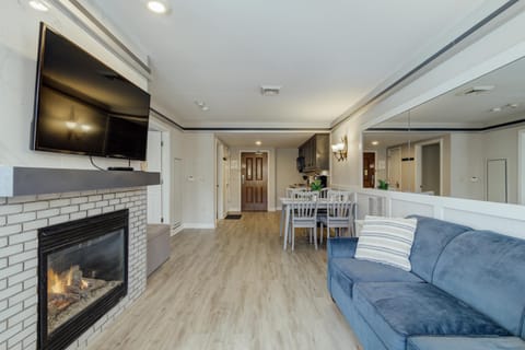 Cozy living room with fireplace and modern entertainment setup