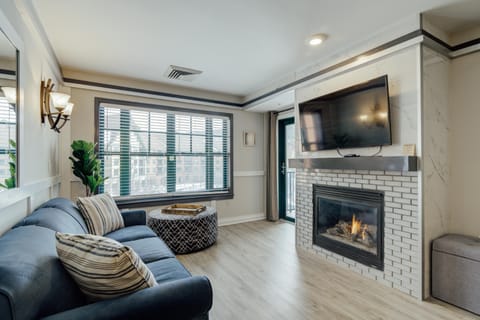 Gorgeous, modern updated condo with marble and glass tile work and new VP flooring throughout
